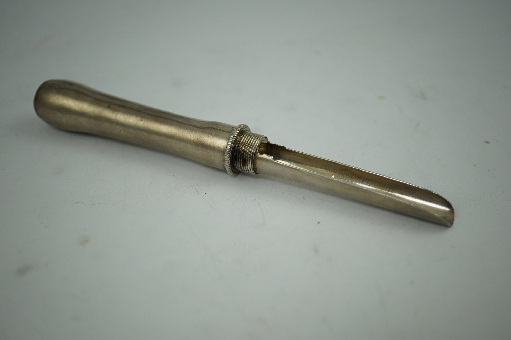 A George IV silver travelling apple corer, maker W?